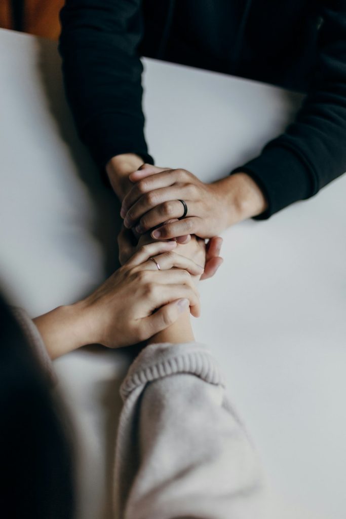 people holding hands